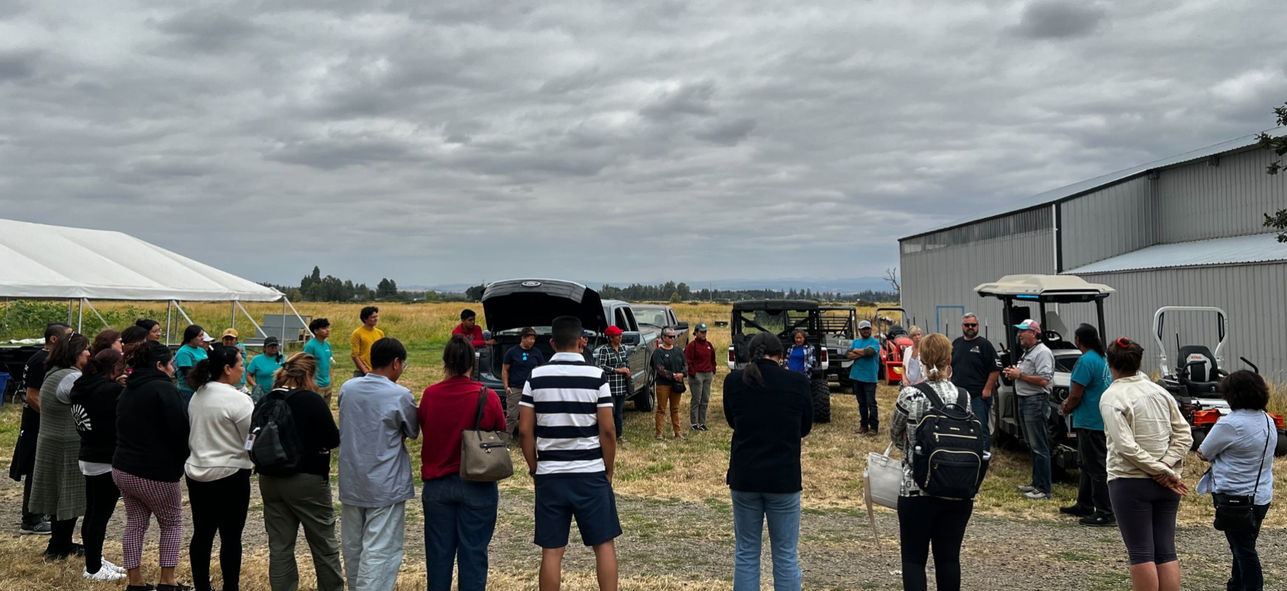 Farmers learning about electric farming equipment