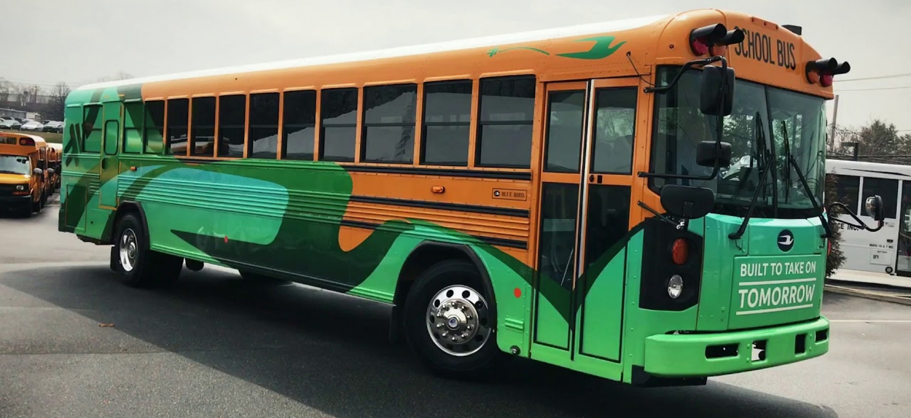 Yellow and Green Electric School Bus