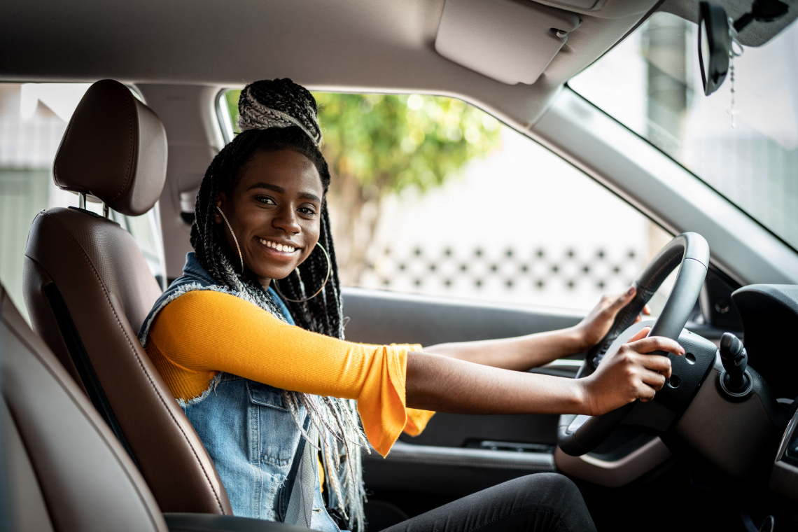 smiling woman in car